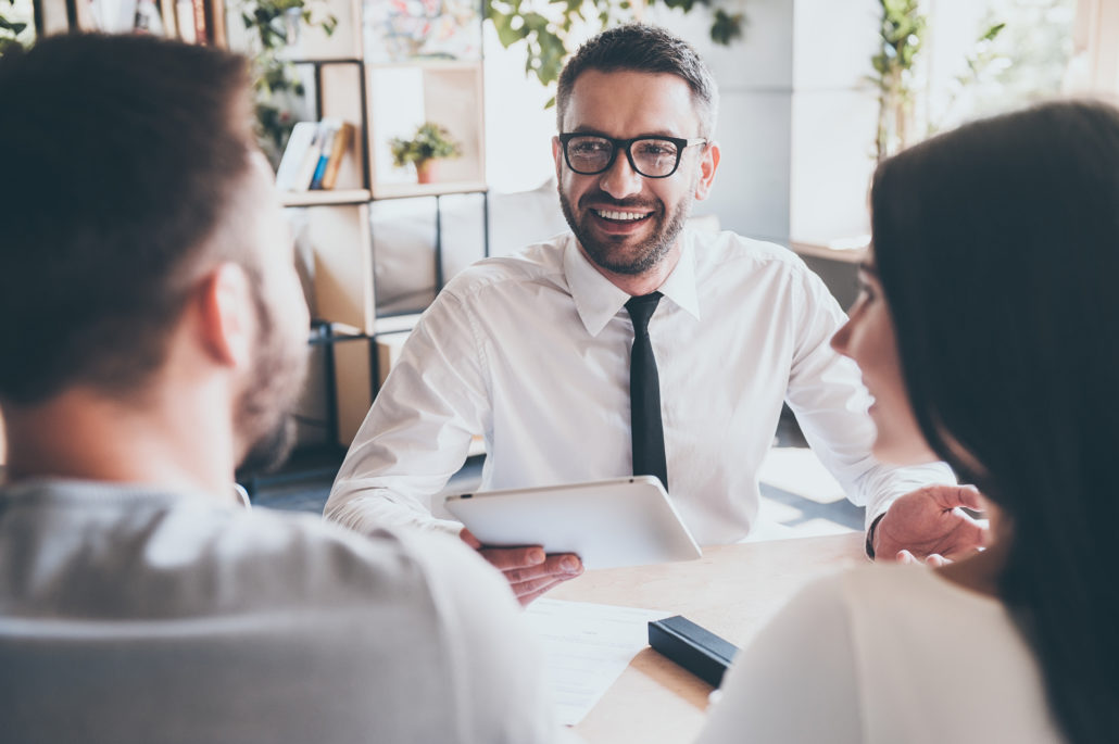 Christian Financial Advisor talking to christian couple